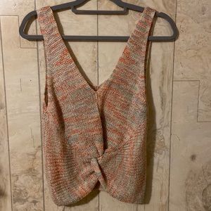 Crocheted cropped tank with tie detail in front.